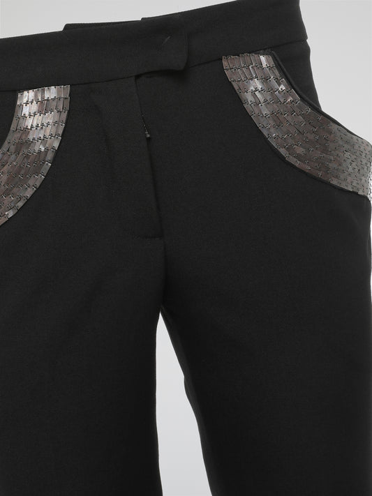 Step into elegance with these stunning Black Embellished Trousers by Roberto Cavalli. Crafted with meticulous care, each detail on these trousers tells a story of sophistication and luxury. From the delicate beaded embellishments to the figure-flattering silhouette, these trousers are a fashion statement that exudes confidence and style.