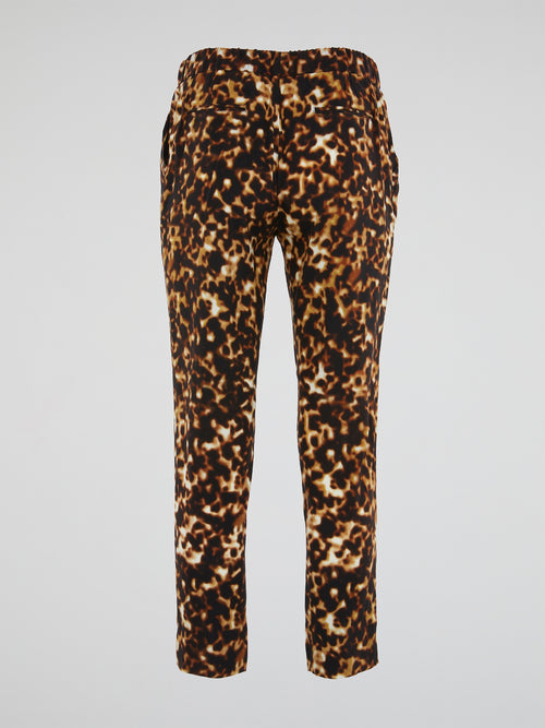 Unleash your inner fierce fashionista with these Leopard Print Elasticated Waist Pants from Roberto Cavalli. Made for the bold and the fearless, these pants exude confidence and style in every step. Elevate your wardrobe with a touch of wild sophistication and turn heads wherever you go.