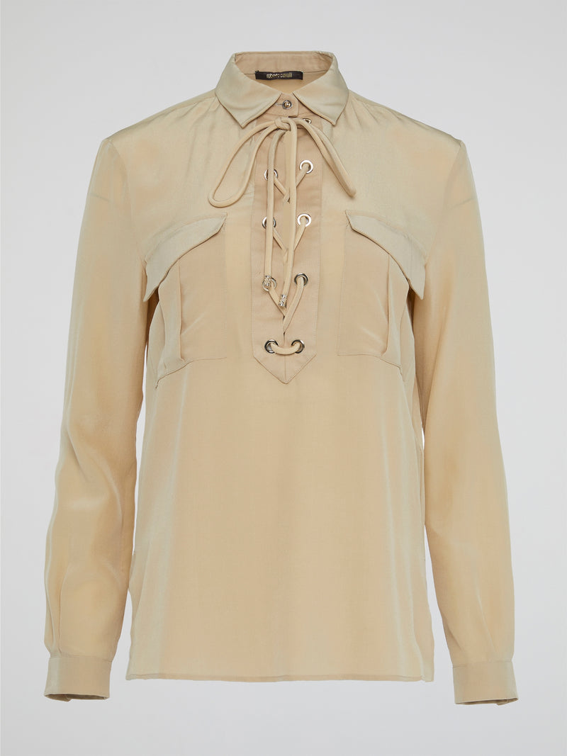 Elevate your wardrobe with the ultimate in luxury and sophistication - the Beige Lace Up Blouse by Roberto Cavalli. Crafted with exquisite attention to detail, this blouse features intricate lace detailing and a flattering silhouette that is sure to turn heads. Embrace your inner fashionista and effortlessly elevate any outfit with this chic and timeless piece.