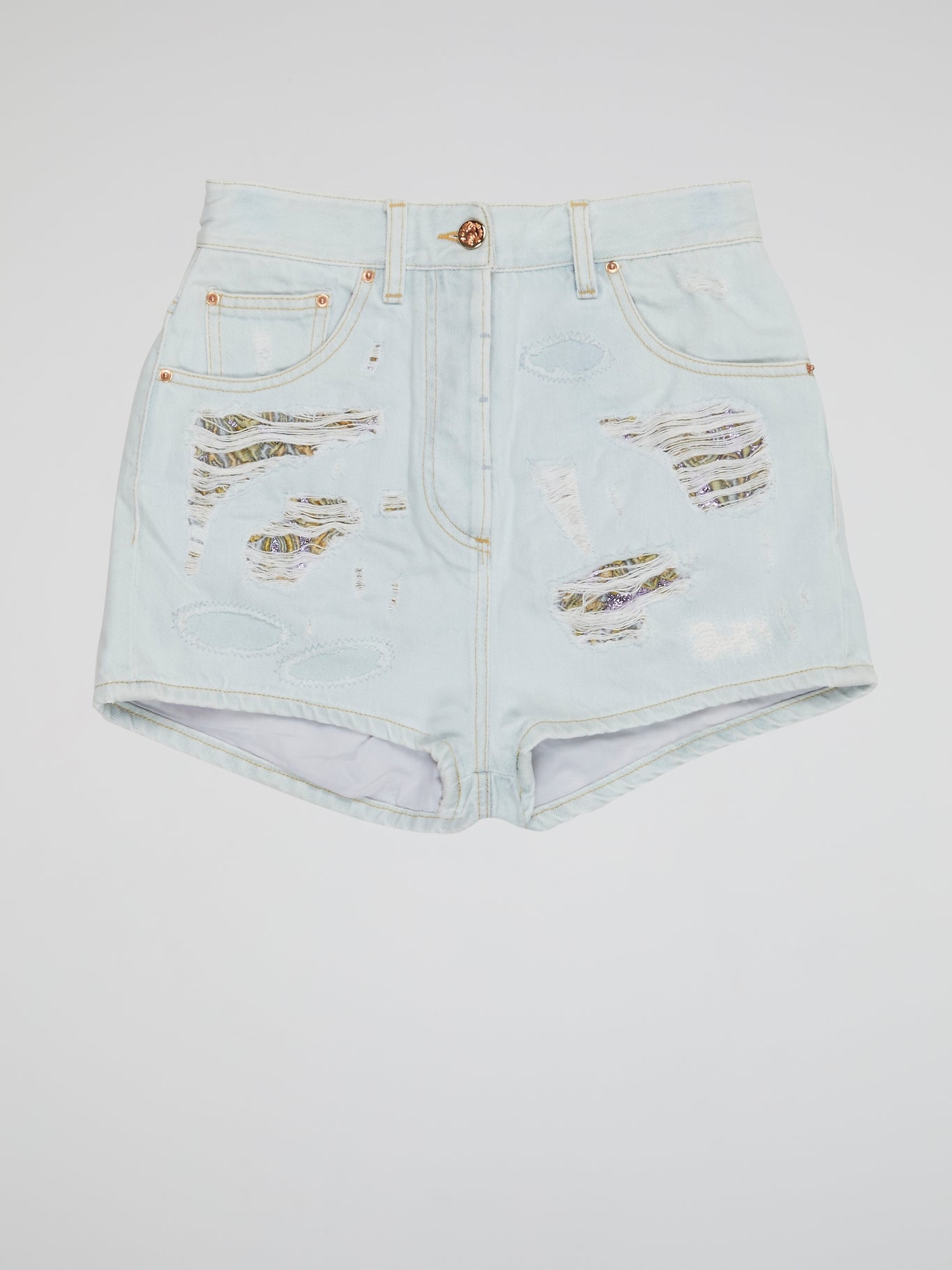 Embrace your inner rebel with our Blue Distressed Denim Shorts by Roberto Cavalli- perfect for any daring fashionista looking to make a statement. With a worn-in look and edgy vibes, these shorts are sure to turn heads wherever you go. From music festivals to beach days, these shorts are a must-have addition to your wardrobe for a bold and fearless style.