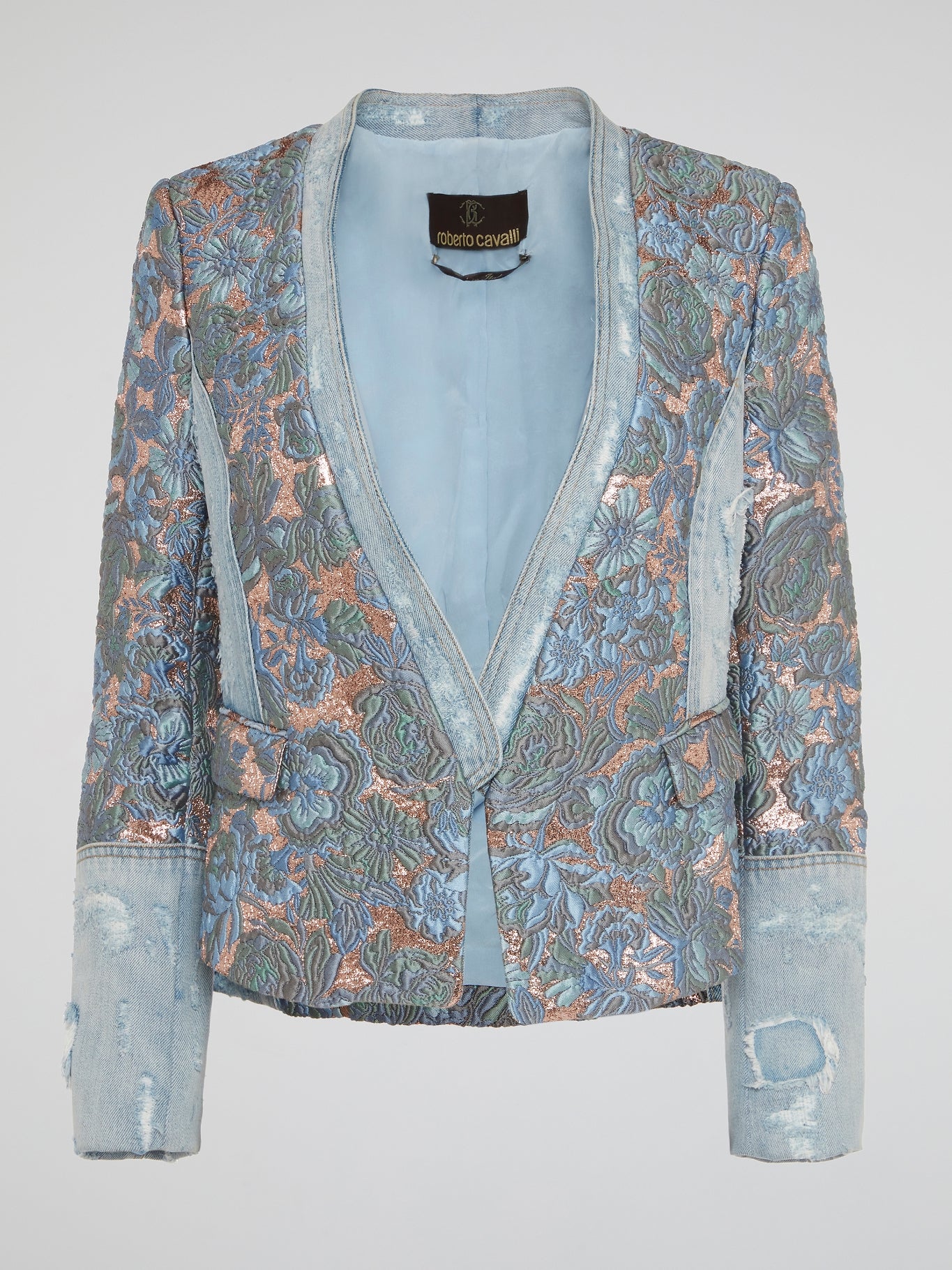 Elevate your street style with the stunning Foliage Embroidered Denim Blazer by Roberto Cavalli - a bold and unique statement piece that will set you apart from the crowd. Made with the highest quality denim and featuring intricate foliage embroidery, this blazer is a true work of art that exudes luxury and sophistication. Stand out in any crowd and turn heads wherever you go with this eye-catching and one-of-a-kind blazer from Roberto Cavalli.