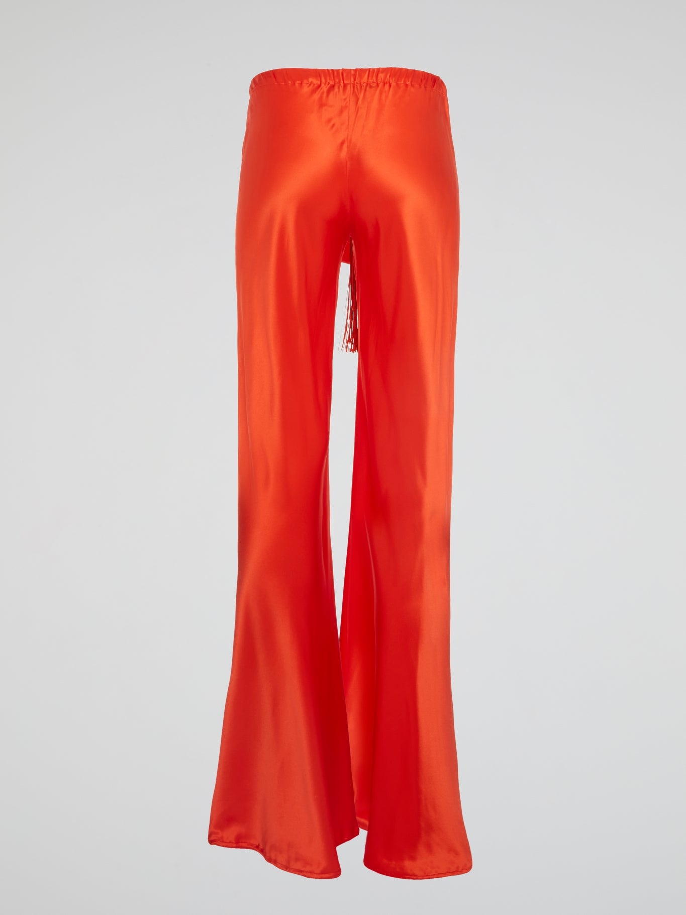 Unleash your inner goddess with these stunning Red Silk Palazzo Pants by Roberto Cavalli. Walk confidently in the flowing silk fabric that drapes elegantly around your legs, exuding luxury and sophistication. Turn heads wherever you go with the bold red color that demands attention and leaves a lasting impression.