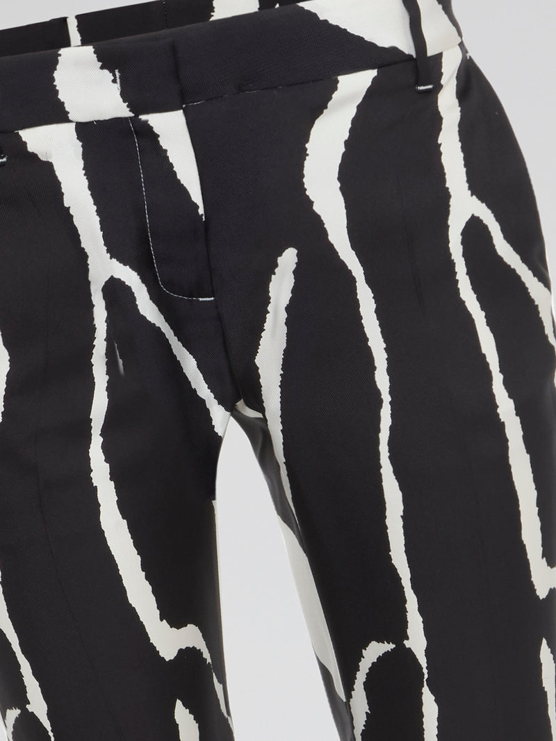 Unleash your wild side with these stunning zebra print wide leg pants from Roberto Cavalli. Made for the bold and the fearless, these pants will add a touch of exotic flair to your wardrobe. Embrace your inner fashionista and stand out from the crowd in these eye-catching statement pants.