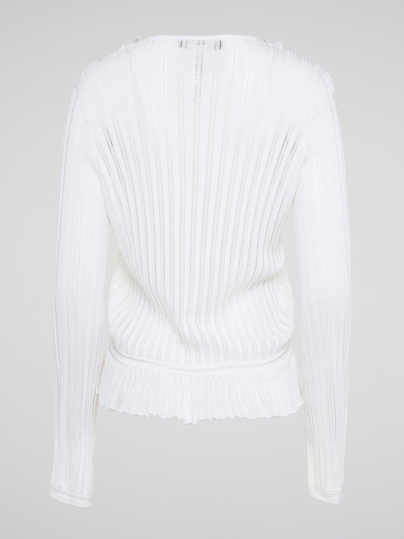 Elevate your wardrobe with the White Rib Knit Long Sleeve Top from Roberto Cavalli. Crafted with luxurious ribbed fabric, this top boasts a flattering silhouette and a timeless white hue perfect for any occasion. Embrace effortless elegance and make a statement with this must-have wardrobe staple.