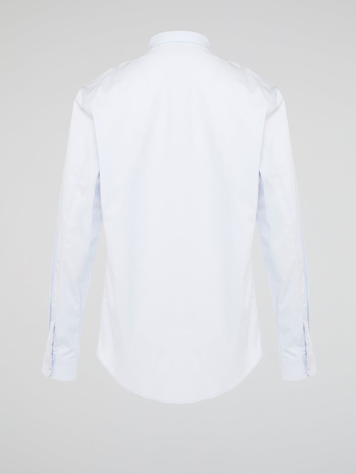 Elevate your wardrobe with the effortlessly chic White Long Sleeve Shirt by Roberto Cavalli. Crafted from luxurious fabric with impeccable attention to detail, this versatile piece exudes sophistication and glamour. Embrace a timeless look that seamlessly transitions from day to night with this must-have staple.