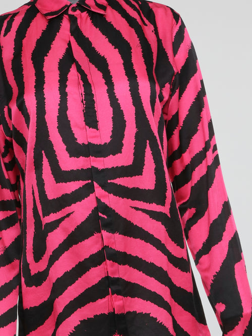 Let your wild side shine with this stunning Pink Zebra Print Shirt by Roberto Cavalli, crafted for the fashion-forward individual who dares to stand out from the crowd. Made with luxurious materials and impeccable attention to detail, this shirt is a bold statement piece that exudes confidence and style. Embrace your inner fashionista and make heads turn wherever you go with this eye-catching and trendy wardrobe essential.