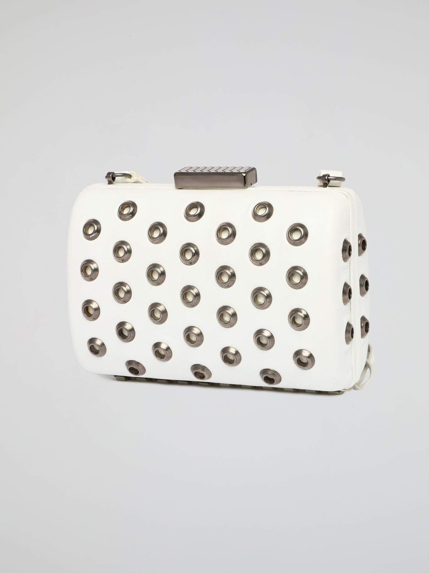 Elevate your accessory game with this stunning white embellished leather clutch by Roberto Cavalli. The intricate detailing and luxurious material make it a standout piece for any special occasion or night out. Make a bold statement and turn heads wherever you go with this elegant and chic clutch in hand.