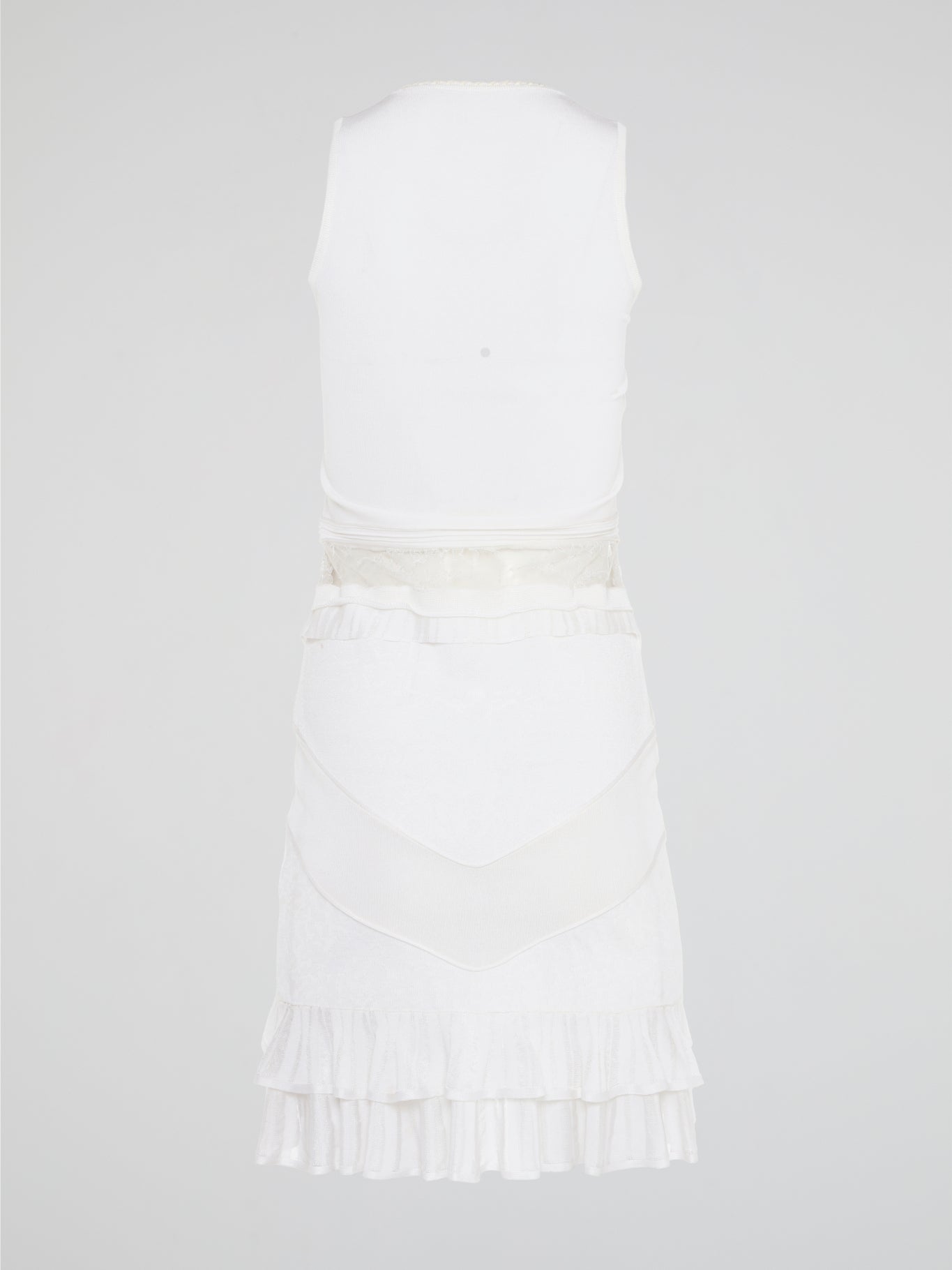 The White Ruffle Dress by Roberto Cavalli will transport you to dreamy summer nights with its ethereal charm. Crafted with intricate layers of delicate ruffles, this dress effortlessly merges elegance with playfulness. From a casual garden party to a glamorous evening soirée, this dress is guaranteed to turn heads and make you feel like a true goddess.