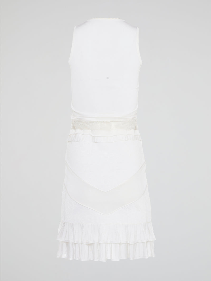 The White Ruffle Dress by Roberto Cavalli will transport you to dreamy summer nights with its ethereal charm. Crafted with intricate layers of delicate ruffles, this dress effortlessly merges elegance with playfulness. From a casual garden party to a glamorous evening soirée, this dress is guaranteed to turn heads and make you feel like a true goddess.