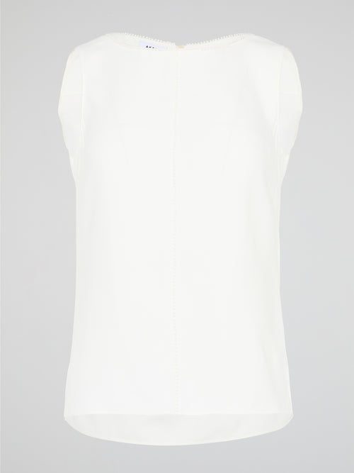 Introducing a timeless masterpiece for fashion-forward mavens - the White Sleeveless Top by Akris Punto. This ethereal beauty effortlessly combines sophistication and elegance with its minimalist design and impeccable tailoring. Crafted from luxurious fabrics, it's the perfect versatile piece to elevate your style, ensuring you're the epitome of chic from desk to dinner.