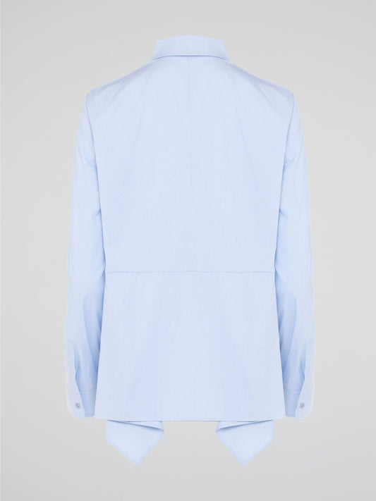 Introducing the Powder Blue High-Low Shirt by Akris Punto, where elegance meets contemporary style. Delicate powder blue hue cascades down the front, enveloping you in a calming wave of tranquility. With its unique high-low hemline and luxurious fabric, this shirt effortlessly elevates any outfit, making it a must-have piece for the fashion-forward trendsetters.