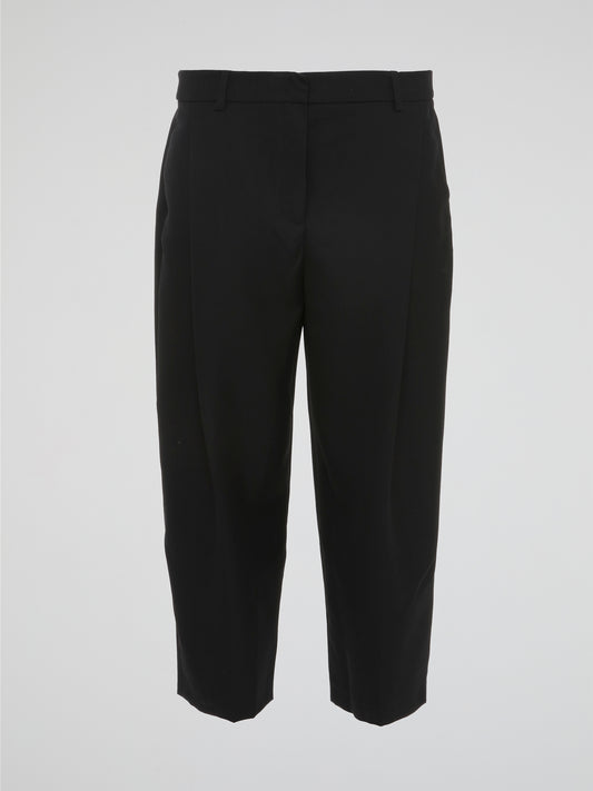 Step into the world of sophisticated style with our Black Pleated Capri Pants by Akris Punto. Crafted with meticulous precision, these pants effortlessly blend elegance and comfort. From the pleated detailing to the flattering capri length, these pants guarantee a chic and timeless addition to your wardrobe.