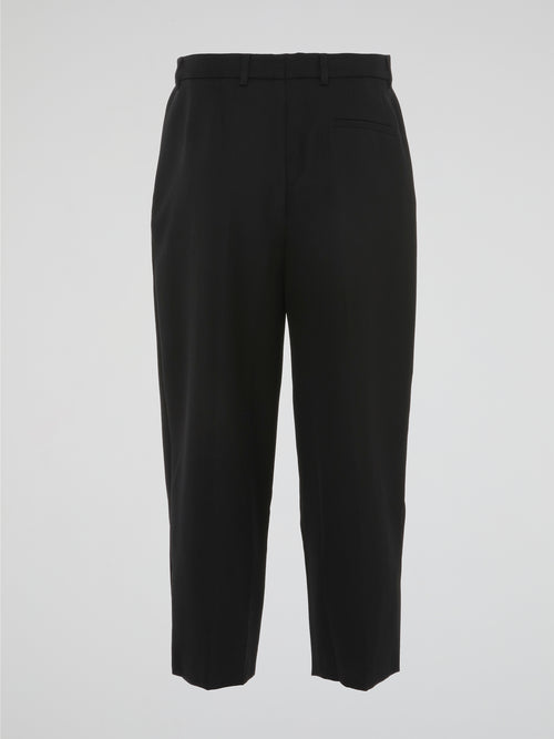 Step into the world of sophisticated style with our Black Pleated Capri Pants by Akris Punto. Crafted with meticulous precision, these pants effortlessly blend elegance and comfort. From the pleated detailing to the flattering capri length, these pants guarantee a chic and timeless addition to your wardrobe.