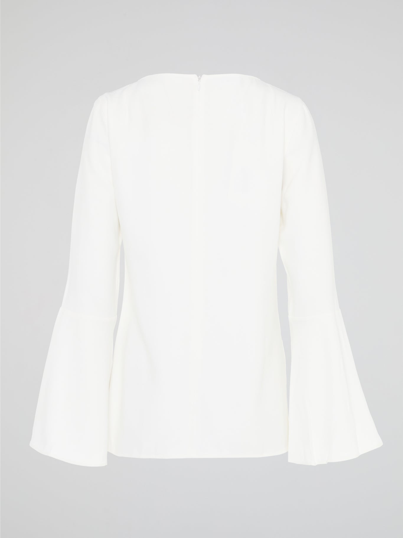 Elevate your everyday look with the White Flared Sleeve Top by Akris Punto. This contemporary and chic piece features unique flared sleeves that add a playful twist to your outfit. Made with high-quality materials, this top guarantees comfort and style, making it a must-have addition to your wardrobe.