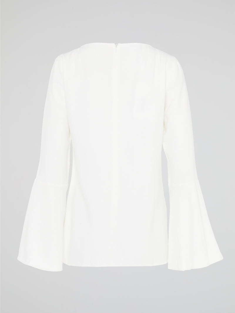 Elevate your everyday look with the White Flared Sleeve Top by Akris Punto. This contemporary and chic piece features unique flared sleeves that add a playful twist to your outfit. Made with high-quality materials, this top guarantees comfort and style, making it a must-have addition to your wardrobe.