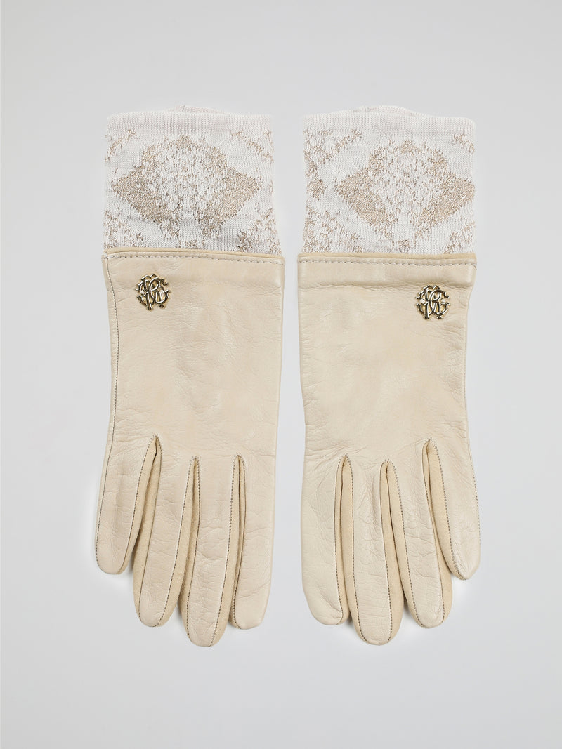 Step into luxury with these exquisite Beige Logo Embellished Gloves by Roberto Cavalli. Crafted with precision and elegance, these gloves feature the iconic Roberto Cavalli logo tastefully embellished on the fine beige leather. Whether you're strolling through the city or attending a glamorous event, these gloves will add a touch of opulence and sophistication to any outfit.