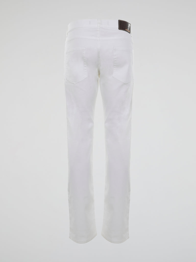 Introducing the epitome of impeccable style, the White Straight Cut Trousers by Roberto Cavalli. Crafted from luxuriously soft fabric, these trousers embrace elegance and sophistication with their sleek silhouette. Elevate your fashion game effortlessly, as you flaunt these timeless trousers that effortlessly blend comfort and class.