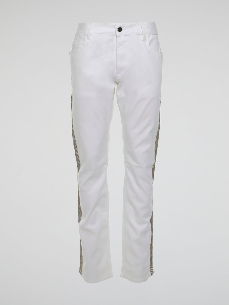 Step into the realm of high fashion with these White Studded Trousers by Roberto Cavalli. Made for those who dare to be different, these trousers feature meticulous studded details that add a touch of rebellious glamour. With their sleek design and luxurious fabric, they are the ultimate statement piece for any fashion-forward individual.