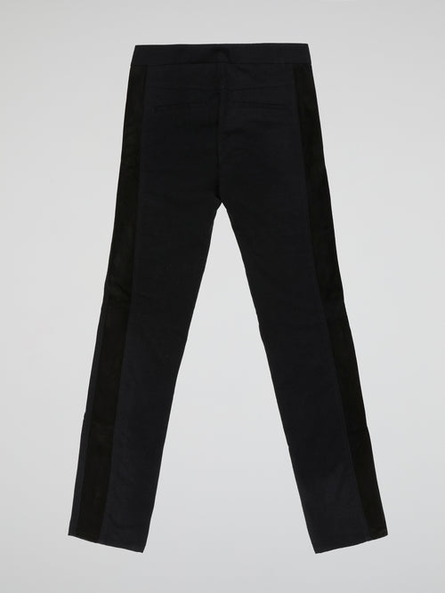 Step into elegance with these stunning Black Embellished Trousers by Roberto Cavalli. Crafted with meticulous care, each detail on these trousers tells a story of sophistication and luxury. From the delicate beaded embellishments to the figure-flattering silhouette, these trousers are a fashion statement that exudes confidence and style.