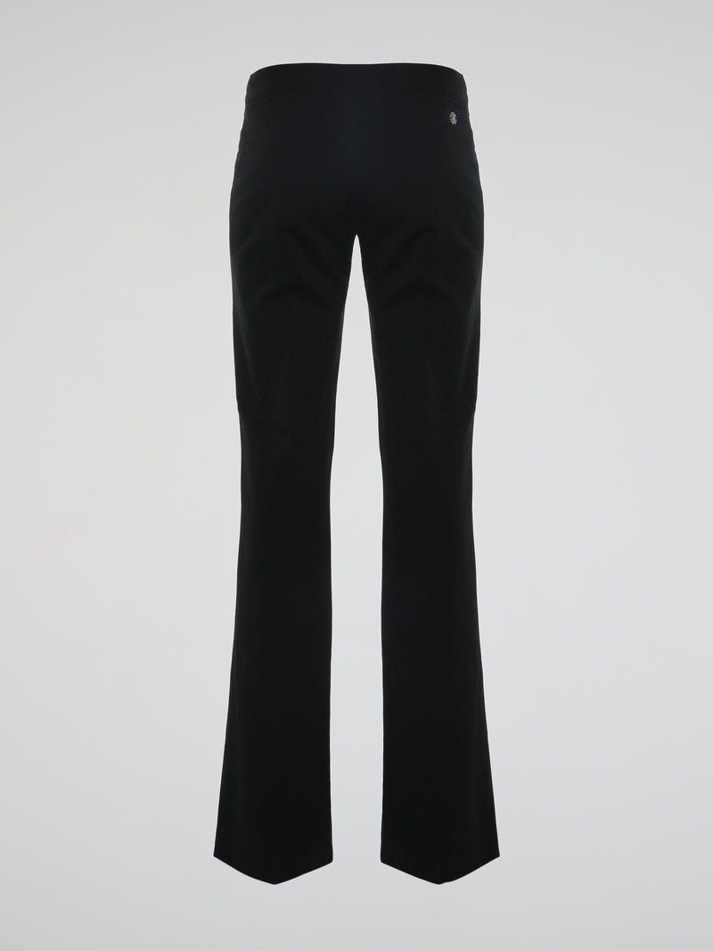 Step into the world of effortless glamour with these Black Flared Trousers by Roberto Cavalli. Crafted with meticulous precision, these trousers boast a striking silhouette that elegantly skims the figure, accentuating every curve. From the office to a night out, these trousers are a timeless wardrobe staple designed to make a bold fashion statement.