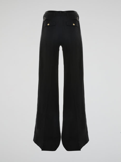 Step into the world of effortless glamour with these Black Flared Trousers by Roberto Cavalli. Crafted with meticulous precision, these trousers boast a striking silhouette that elegantly skims the figure, accentuating every curve. From the office to a night out, these trousers are a timeless wardrobe staple designed to make a bold fashion statement.