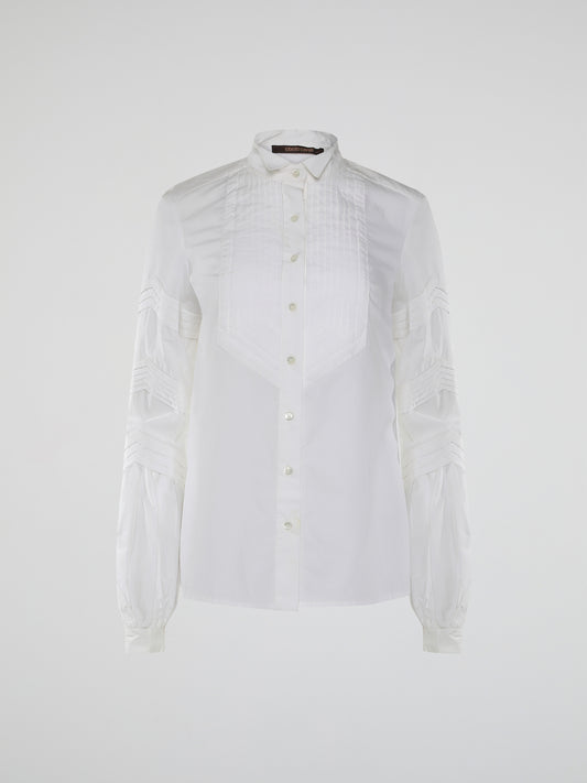 Step into the world of timeless elegance with the White Pleated Bib Shirt from Roberto Cavalli. Crafted with meticulous attention to detail, this masterpiece combines effortless sophistication with a touch of whimsical charm. From its delicate pleated bib to its crisp white fabric, this shirt will make a statement in any setting, exuding refined elegance that is truly captivating.