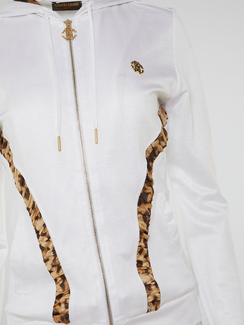 Step into the wild side of fashion with our White Leopard Panel Tracksuit by Roberto Cavalli. This sleek and stylish ensemble combines the elegance of Italian design with the fierce beauty of a white leopard pattern. Crafted with premium fabrics and adorned with Cavalli's signature logo, this tracksuit is a bold statement piece that will make you feel like the ruler of the fashion jungle.