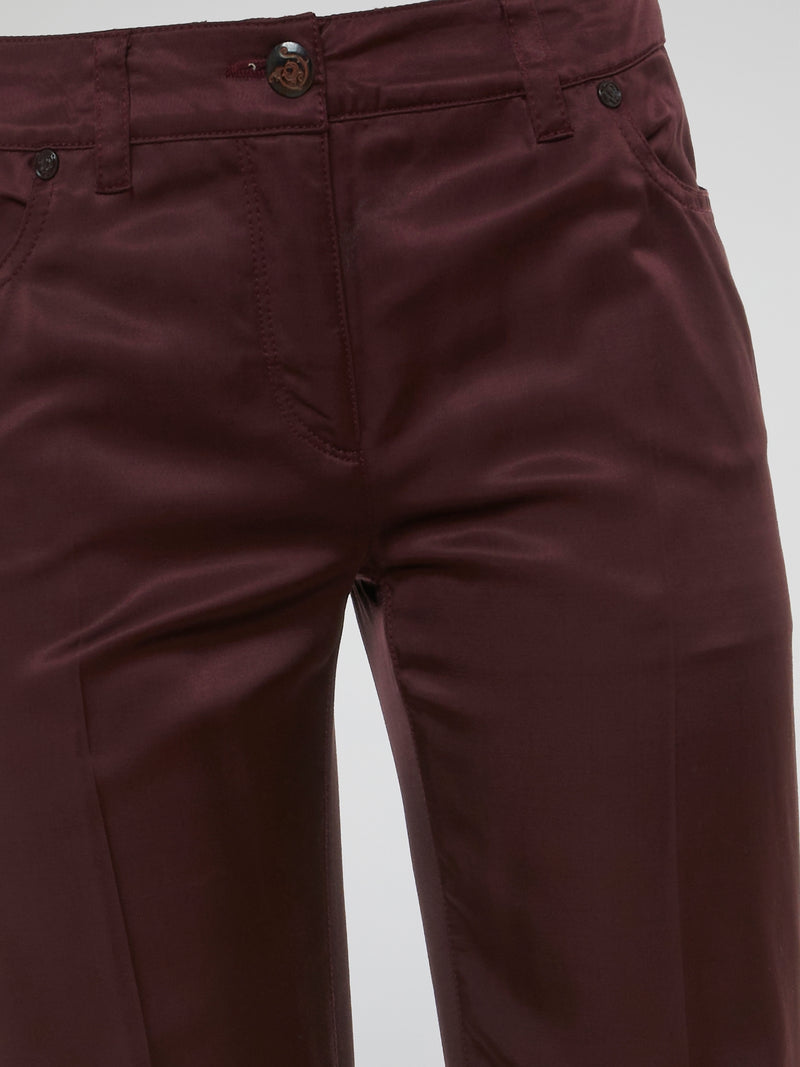 Step up your fashion game with these Burgundy Flared Pants by Clas Roberto Cavalli. Crafted from luxurious materials, these pants offer a sleek and chic silhouette with a touch of retro flair. Perfect for both formal and casual occasions, they effortlessly elevate any outfit, making you the style icon wherever you go.