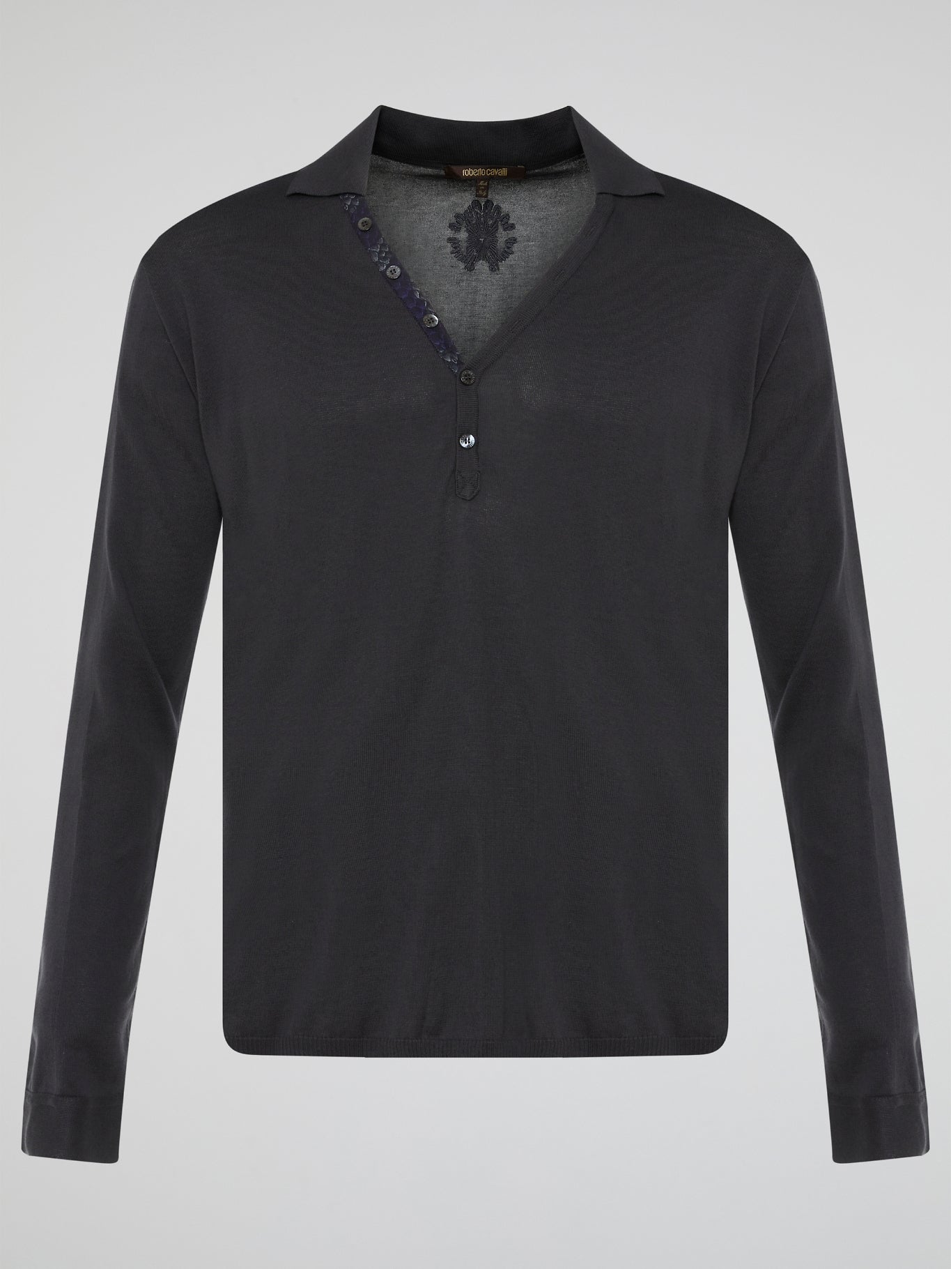 Elevate your style with the timeless elegance of our Black Long Sleeve Polo Shirt by Roberto Cavalli. Crafted with meticulous attention to detail, this wardrobe staple features a luxurious blend of comfort and sophistication. Whether you're headed to a casual brunch or a formal event, this Polo Shirt will effortlessly take you from day to night with its sleek design and iconic Cavalli logo.