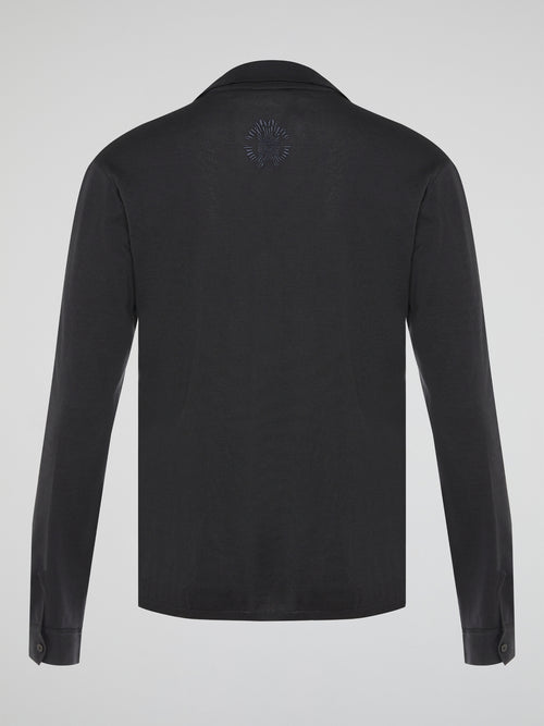 Elevate your style with the timeless elegance of our Black Long Sleeve Polo Shirt by Roberto Cavalli. Crafted with meticulous attention to detail, this wardrobe staple features a luxurious blend of comfort and sophistication. Whether you're headed to a casual brunch or a formal event, this Polo Shirt will effortlessly take you from day to night with its sleek design and iconic Cavalli logo.