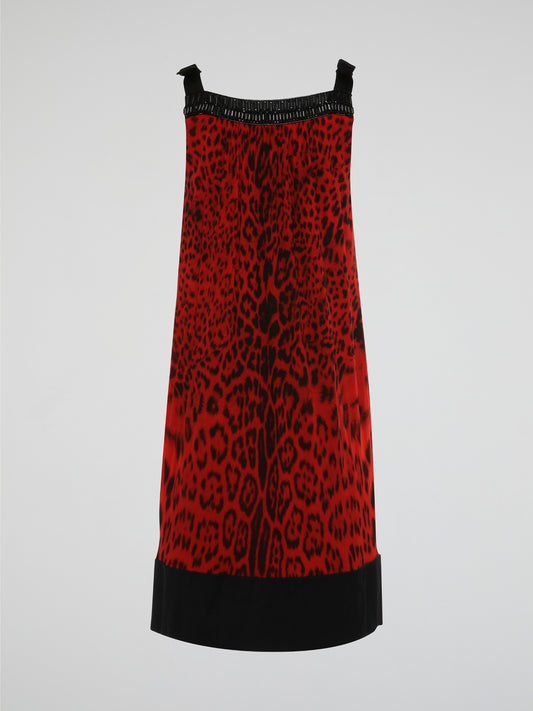 Step into the wild side with this fierce Red Leopard Print Shift Dress by Roberto Cavalli. Crafted from luxurious fabric, this dress is a statement piece perfect for any glamorous occasion. Embrace your inner fashionista and unleash your bold, confident style with this striking and stunning design.