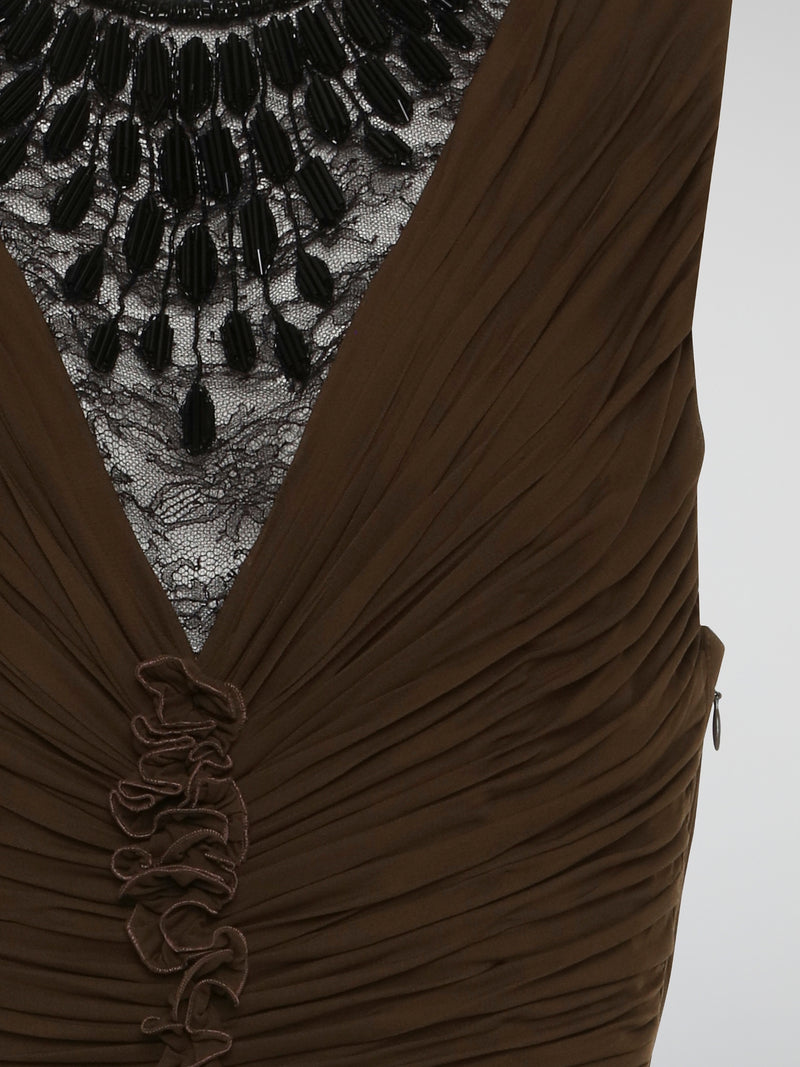 Elevate your evening attire with the sophisticated elegance of the Brown Lace Neckline Ruched Dress by Roberto Cavalli. The intricate lace neckline adds a touch of femininity, while the ruched detailing creates a flattering silhouette. Perfect for any special occasion, this dress exudes luxury and timeless style.