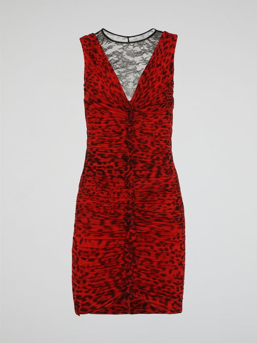 Make a fierce statement with this red leopard print ruched dress from Roberto Cavalli. The bold animal print pattern combined with the flattering ruched detailing creates a stunning and eye-catching look. Perfect for a night out or special event, this dress will make you stand out from the crowd in style.