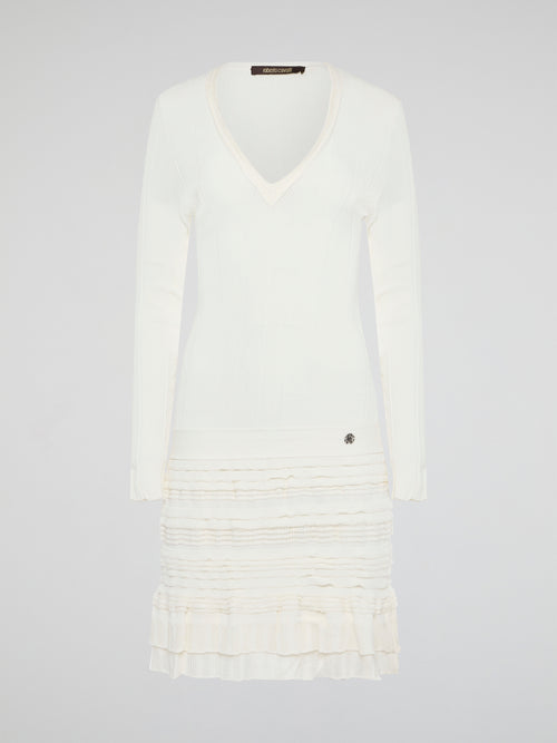 Elevate your winter wardrobe with the luxurious White Knitted Sweater Dress by Roberto Cavalli. This chic and sophisticated piece features intricate knit detailing and a flattering silhouette that will turn heads wherever you go. Whether you're dressing it up with heels for a night out or styling it casually with boots, this sweater dress is sure to make a statement.