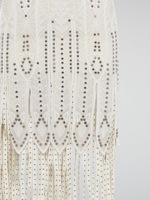 Step out in style in this stunning White Embroidered Fringe Dress from iconic designer Roberto Cavalli. The intricate embroidery detailing and playful fringe trim add a touch of bohemian elegance to this timeless piece. Whether you're hitting the beach or attending a summer soirée, this dress is sure to turn heads and make a statement.