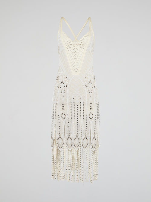 Step out in style in this stunning White Embroidered Fringe Dress from iconic designer Roberto Cavalli. The intricate embroidery detailing and playful fringe trim add a touch of bohemian elegance to this timeless piece. Whether you're hitting the beach or attending a summer soirée, this dress is sure to turn heads and make a statement.