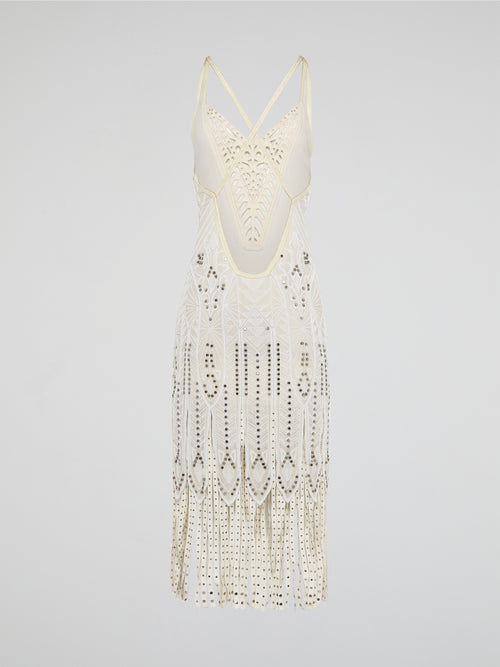 Step out in style in this stunning White Embroidered Fringe Dress from iconic designer Roberto Cavalli. The intricate embroidery detailing and playful fringe trim add a touch of bohemian elegance to this timeless piece. Whether you're hitting the beach or attending a summer soirée, this dress is sure to turn heads and make a statement.