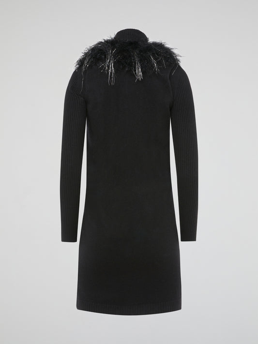 Step out in style and turn heads in our luxurious Black Faux Fur Sweater Dress by Blumarine. This fierce and fabulous dress features a soft faux fur exterior that will make you feel like a true fashionista. Whether you're hitting the town or cozying up at home, this dress is sure to make a statement and keep you warm all season long.