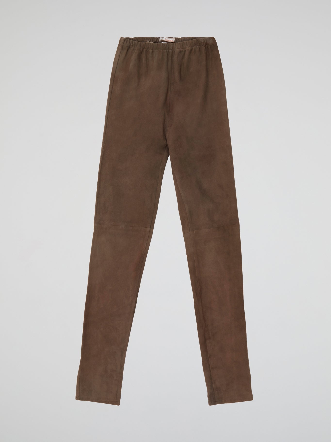 Indulge in luxurious comfort with our Brown Suede Trousers by Max And Moi - the epitome of chic sophistication. Crafted from the finest quality suede, these trousers offer a sleek silhouette and a touch of textural elegance. Elevate your everyday look with this statement piece that seamlessly transitions from day to night.