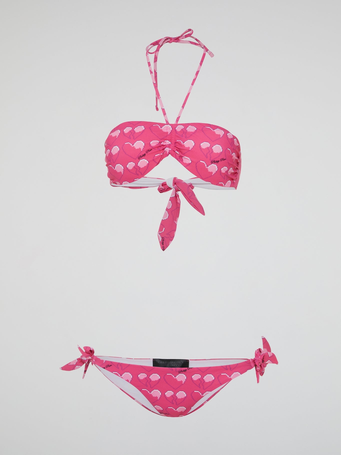 Dive into summer in style with our Pink Heart Print Swimwear by Philipp Plein. Whether you're lounging by the pool or catching some waves at the beach, this vibrant and playful design is sure to turn heads. Made with high-quality materials, you'll feel confident and chic all season long in this must-have swimwear.