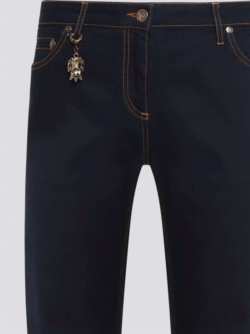 Step up your denim game with Roberto Cavalli's Navy Contrast Stitch Jeans. These sleek, stylish jeans feature a classic navy wash with contrasting white stitching for a bold, eye-catching look. With their slim fit and high-quality construction, these jeans are sure to become a staple in your wardrobe.