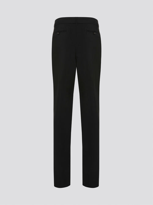 Step up your style game with these chic Black Belted Pleated Trousers by Roberto Cavalli, designed to make a statement. The flattering pleats and elegant belt detailing give these trousers a sophisticated edge, perfect for any fashion-forward individual. Whether worn to the office or a night out on the town, these trousers are sure to turn heads and leave a lasting impression.