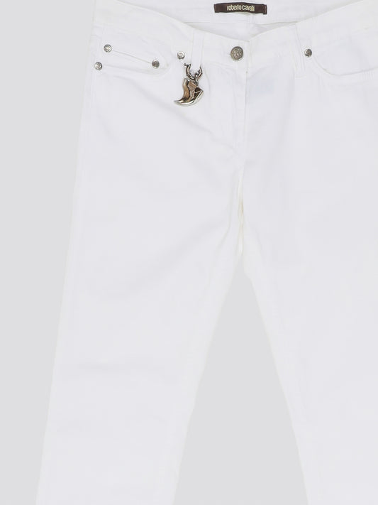 Indulge in timeless elegance and modern sophistication with these White Straight Leg Jeans by Roberto Cavalli. Crafted with precision and attention to detail, these jeans feature a sleek silhouette that effortlessly complements any ensemble. Elevate your everyday wardrobe with a touch of luxury and style with these iconic Roberto Cavalli jeans.