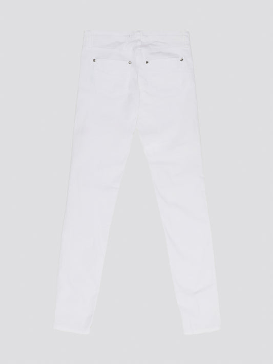 Indulge in timeless elegance and modern sophistication with these White Straight Leg Jeans by Roberto Cavalli. Crafted with precision and attention to detail, these jeans feature a sleek silhouette that effortlessly complements any ensemble. Elevate your everyday wardrobe with a touch of luxury and style with these iconic Roberto Cavalli jeans.