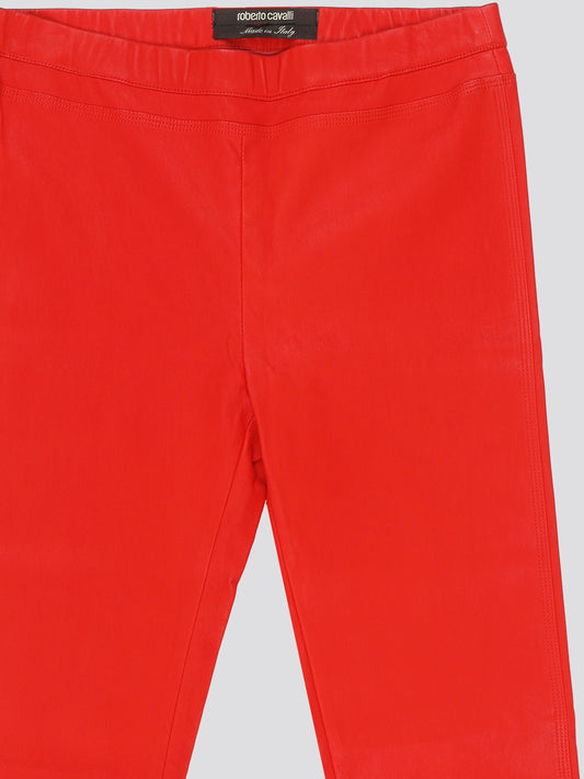 Step out in bold style with these stunning Red Elasticated Waist Trousers from Roberto Cavalli. The vibrant red hue is sure to turn heads, while the elasticated waist ensures a comfortable and flattering fit. Perfect for adding a pop of color to your wardrobe and making a statement wherever you go.