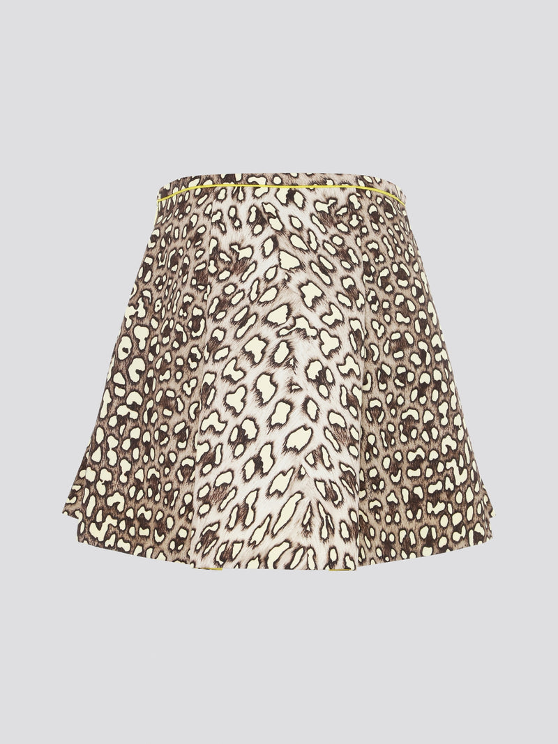 Unleash your wild side with the Leopard Print Box Pleat Mini Skirt from Roberto Cavalli. This fierce and flirty skirt features a bold leopard print pattern that is sure to turn heads wherever you go. With its flattering box pleats and mini length, this skirt is perfect for a night out on the town or a stylish day at the office.