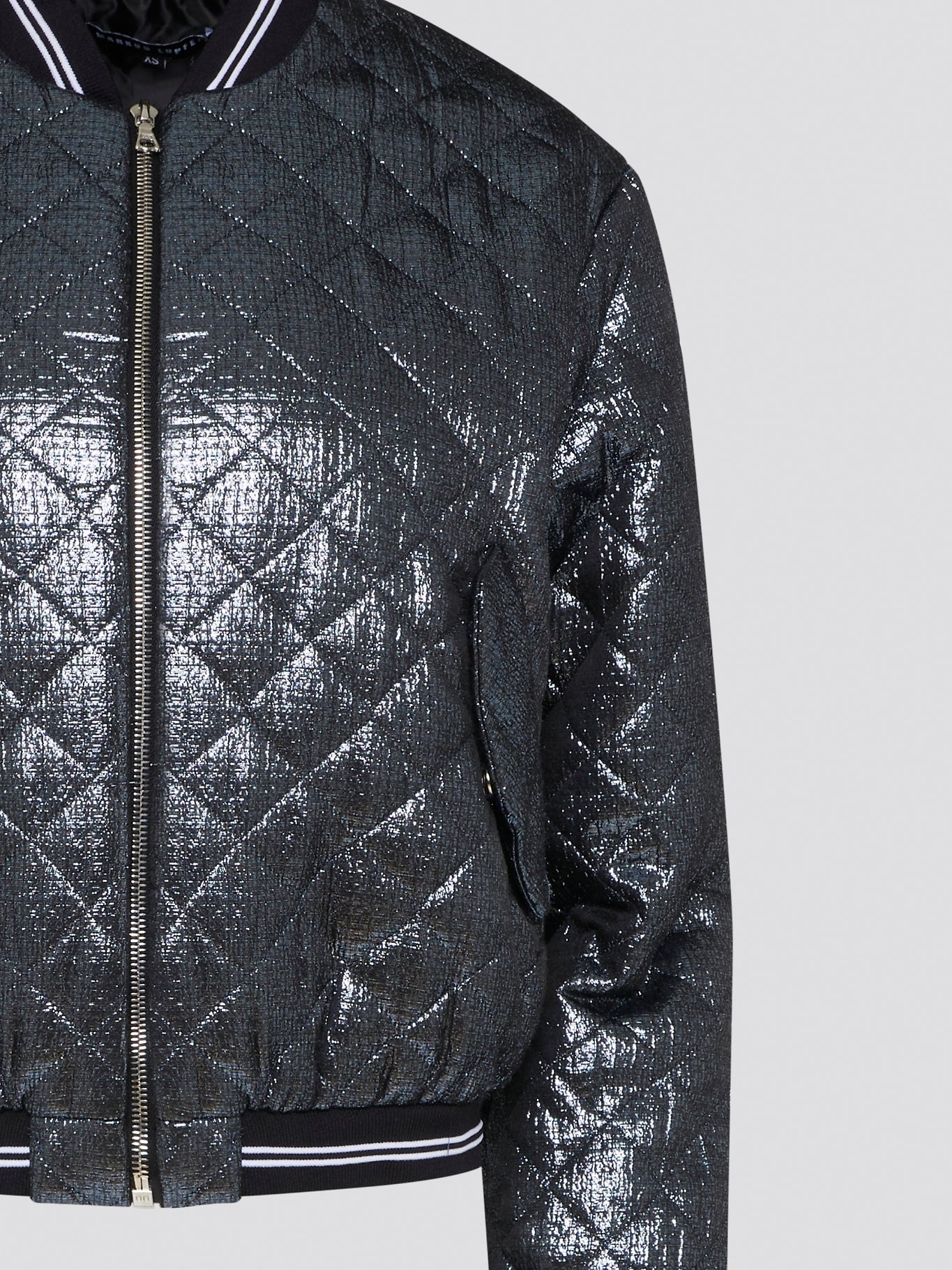 Elevate your outerwear game with the Markus Lupfer Metallic Quilted Bomber Jacket. This stunning piece combines edgy metallic fabric with classic quilted stitching for a truly unique look. Whether you're heading to a concert or a night out on the town, this jacket is sure to turn heads and make a statement.