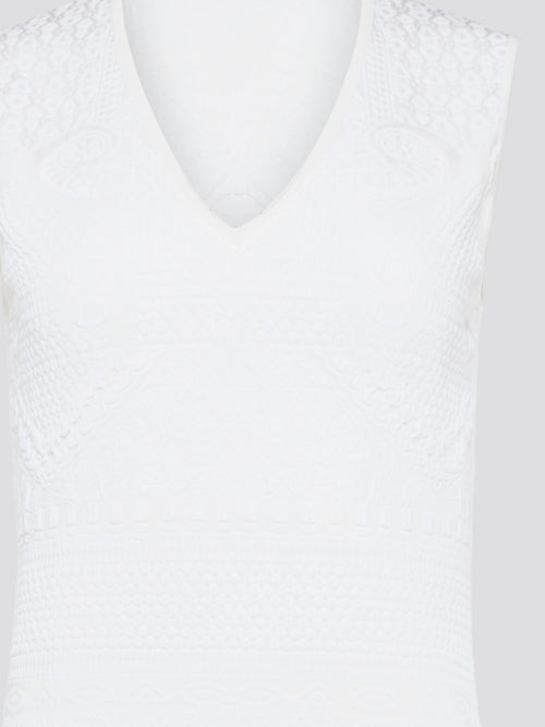 Feel effortlessly chic and sophisticated in this stunning White Sleeveless Mini Dress by Roberto Cavalli. The epitome of Italian luxury, the dress features a flattering silhouette and intricate detailing that is sure to turn heads. Perfect for any occasion, whether it's a summer soirée or a glamorous night out, this dress is a must-have for any fashion-forward woman.