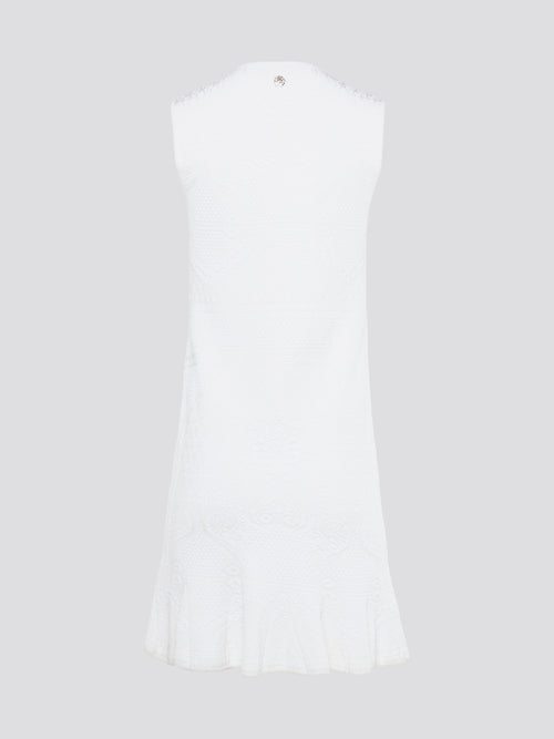 Feel effortlessly chic and sophisticated in this stunning White Sleeveless Mini Dress by Roberto Cavalli. The epitome of Italian luxury, the dress features a flattering silhouette and intricate detailing that is sure to turn heads. Perfect for any occasion, whether it's a summer soirée or a glamorous night out, this dress is a must-have for any fashion-forward woman.