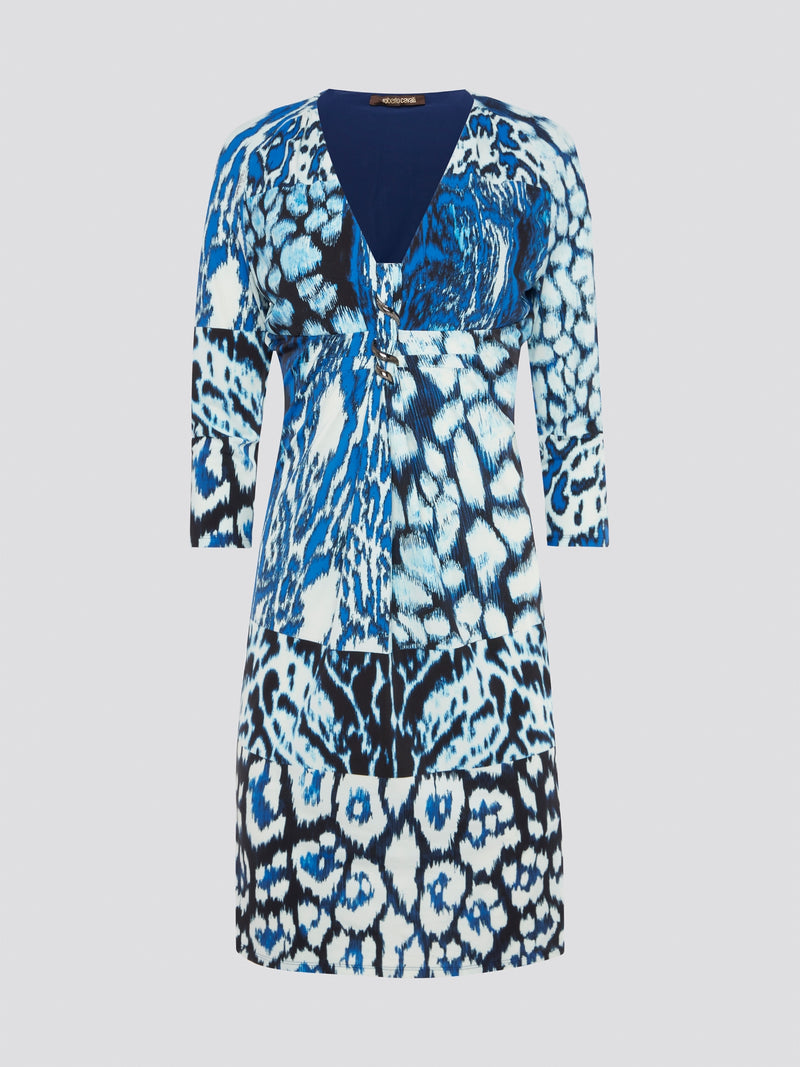 Indulge your wild side with the Blue Animal Print Plunge Dress by Roberto Cavalli - a fierce and fabulous statement piece that will turn heads wherever you go. The plunging neckline adds a touch of allure while the bold animal print exudes confidence and style. Step into this dress and unleash your inner fashionista for a night out on the town.